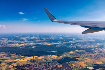5 tips for traveling green - outside of airplane view