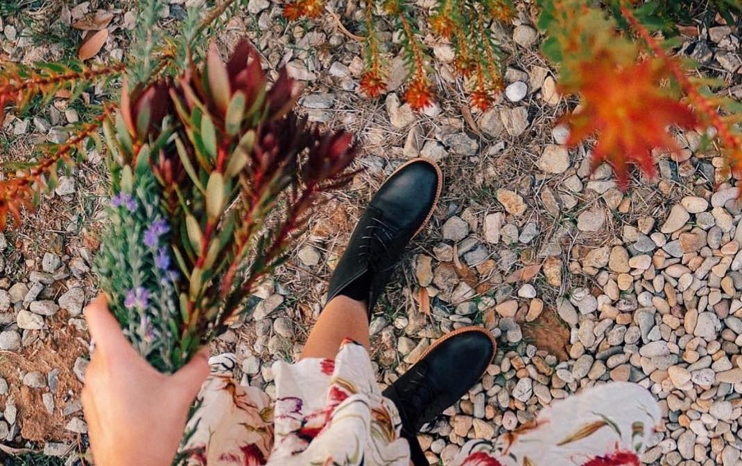 woman wearing fortress of inca boots at a music festival