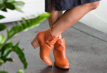 woman wearing ani rust fotress of inca boots crossing leg