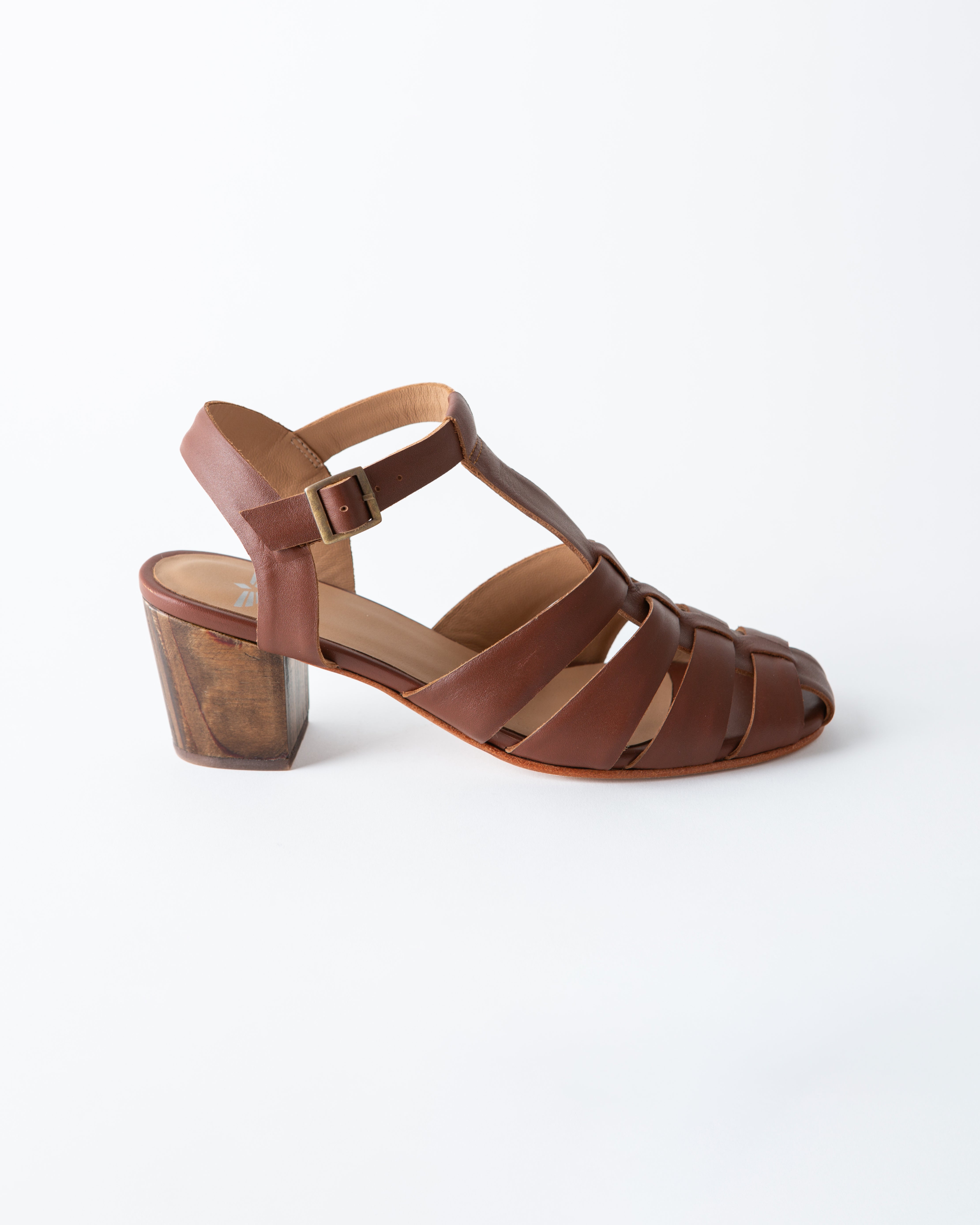 Brown sandal with a block heel on a white background