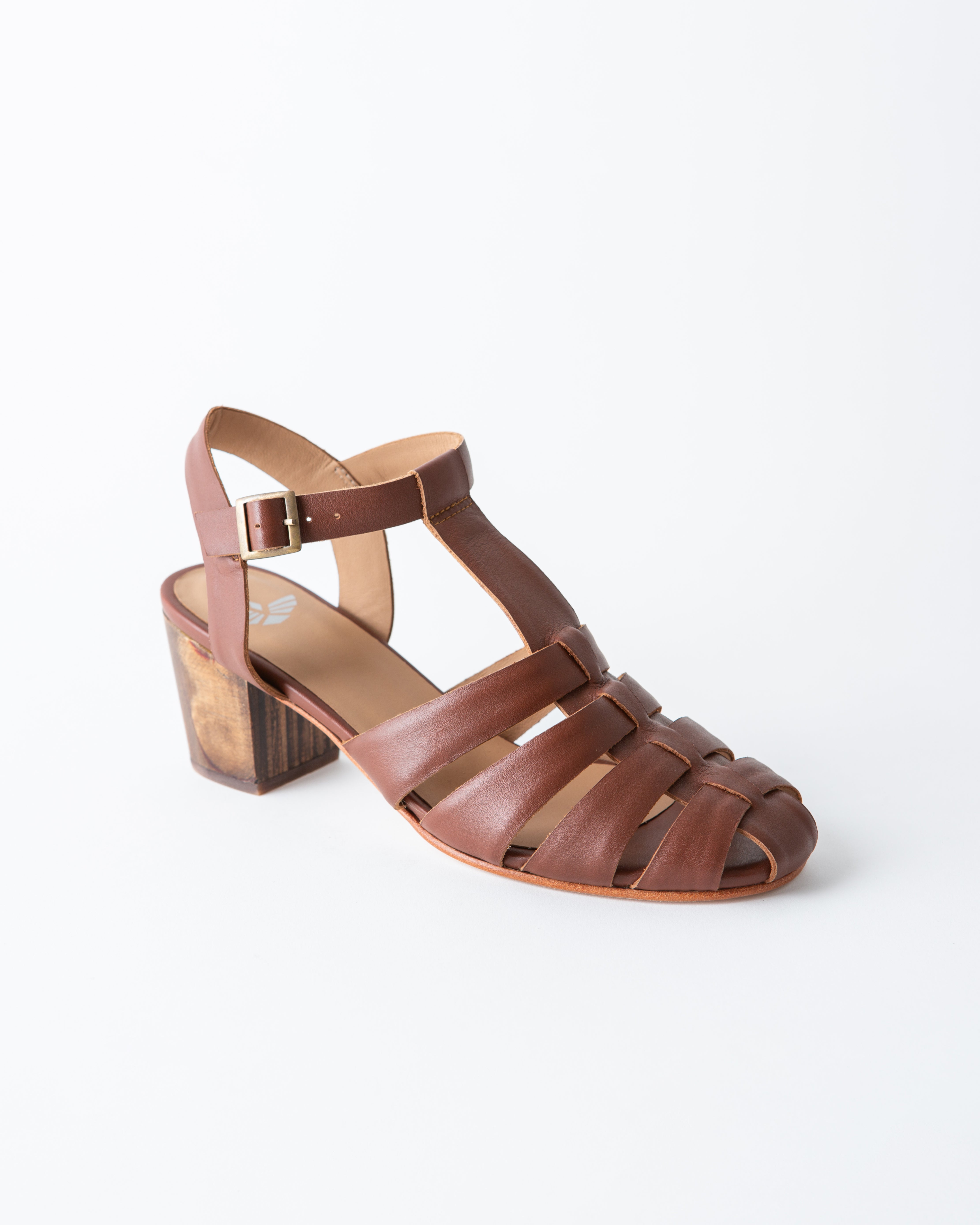 Brown sandal with a block heel on a white background