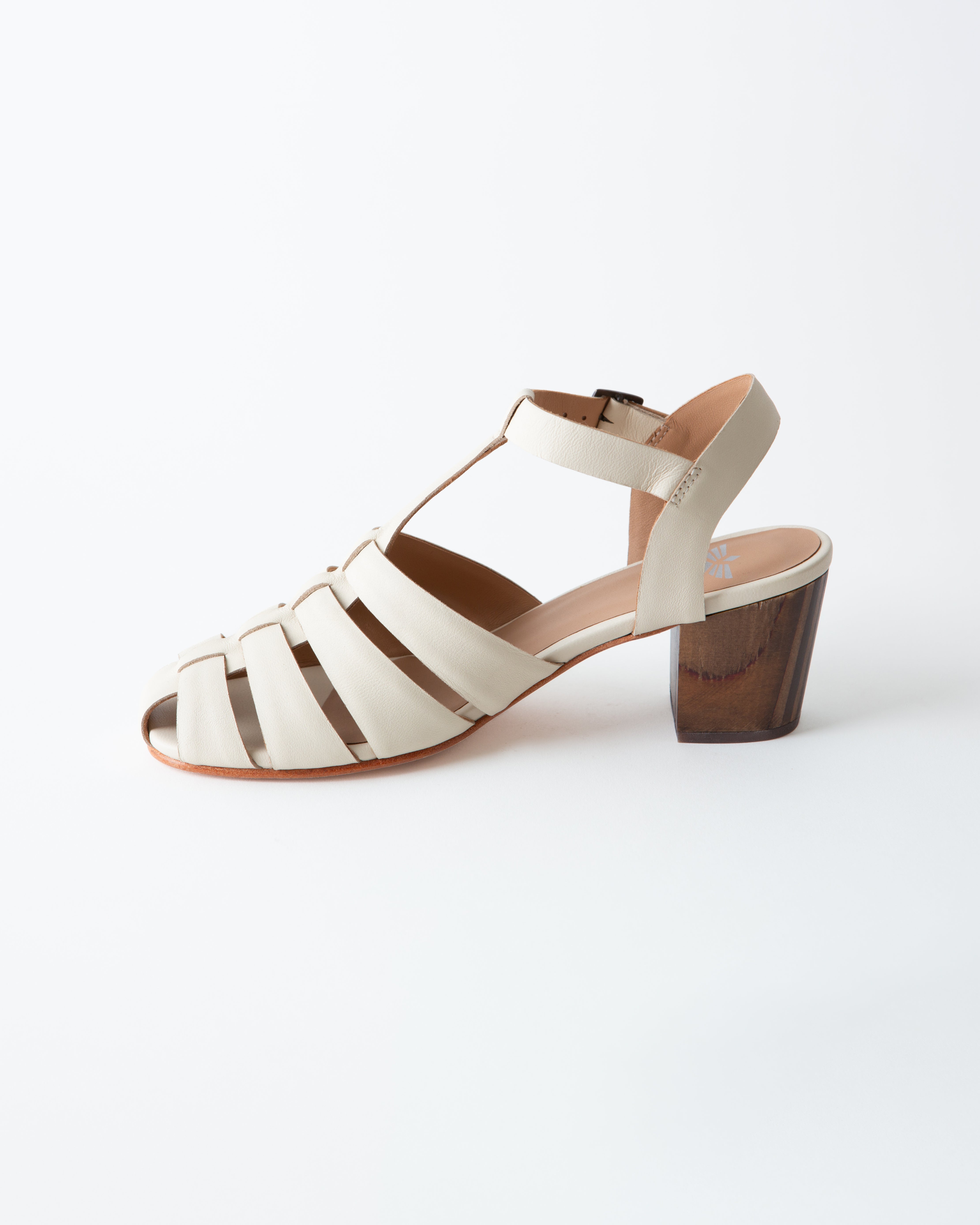 White sandal with wooden heel on a white background