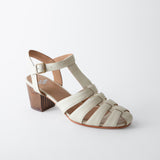 Beige sandal with a wooden block heel on a white background