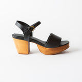 black leather clog sandal on a white background