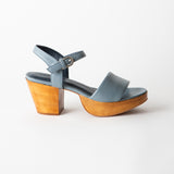 Blue sandal with wooden heel on a white background