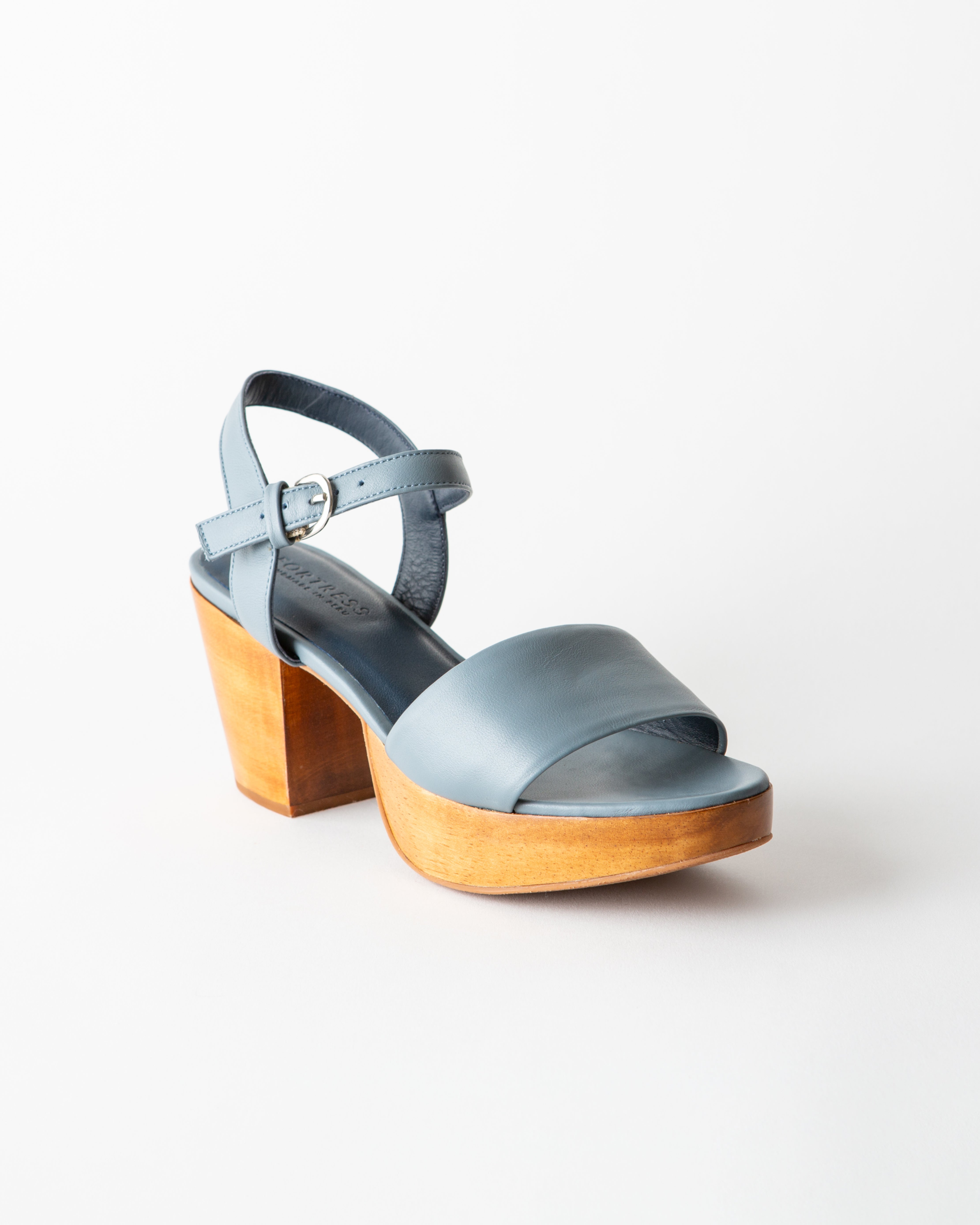 Blue sandal with wooden heel on a white background