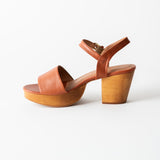 brown leather clog sandal on a white background