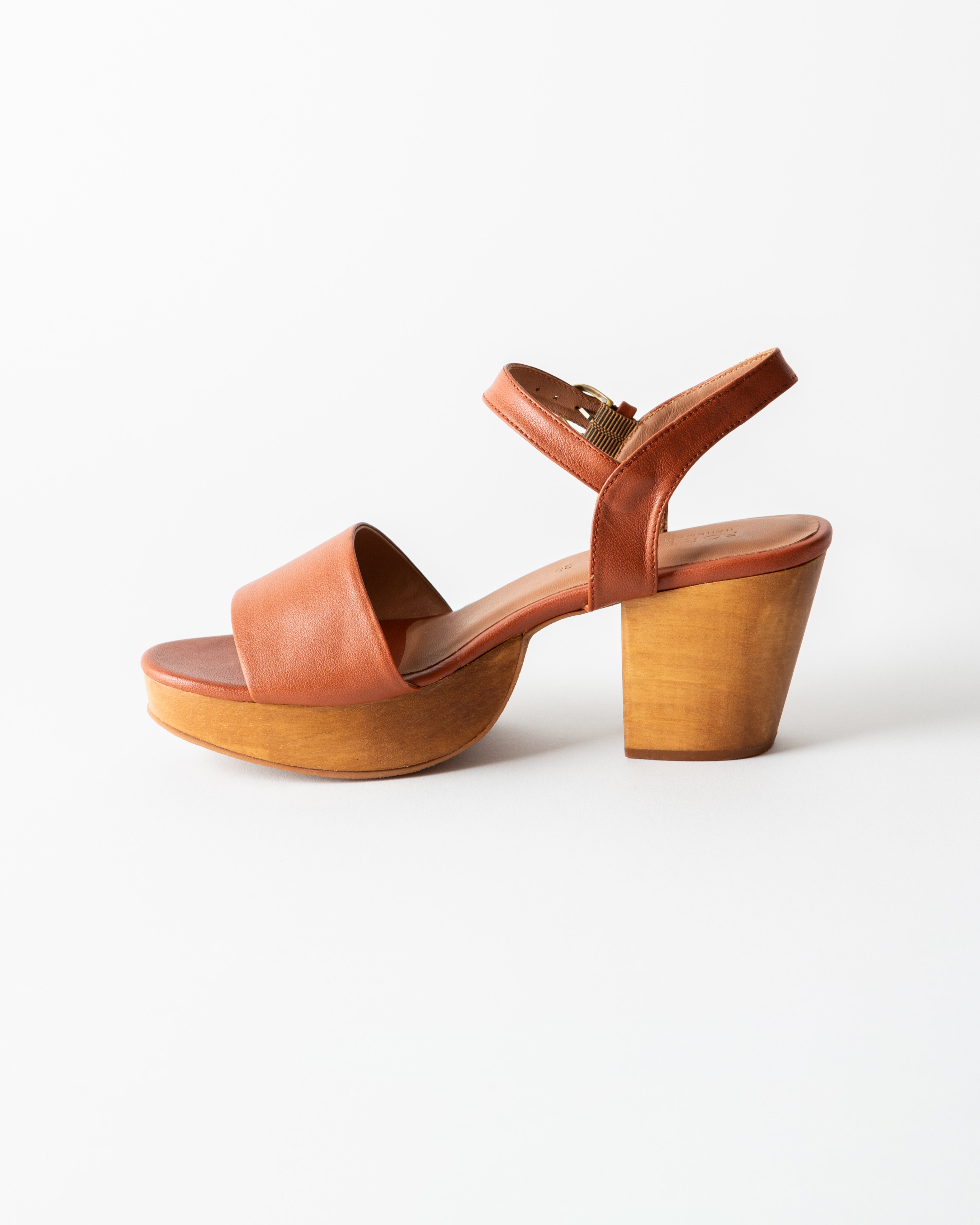 brown leather clog sandal on a white background