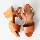 brown leather clog sandals on a white background