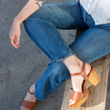 Hannah Platform Clogs in whiskey on the sidewalk in Austin