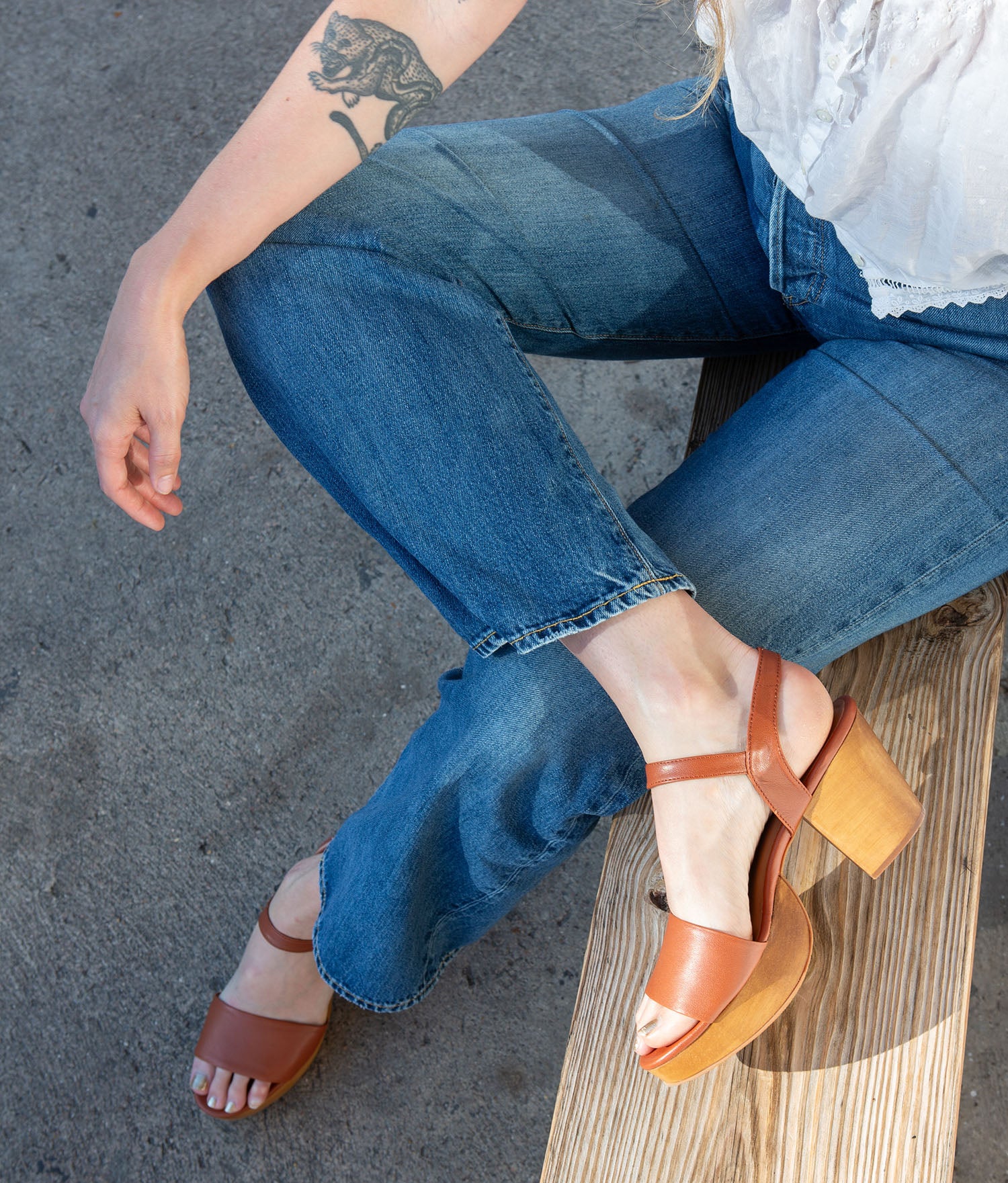 Hannah Platform Clogs in whiskey on the sidewalk in Austin