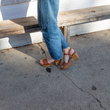 Hannah Platform Clogs in whiskey on the sidewalk in Austin