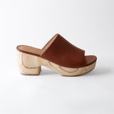 Brown wooden clog shoe on a white background