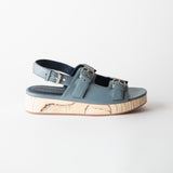 Blue sandals with cork sole on a white background