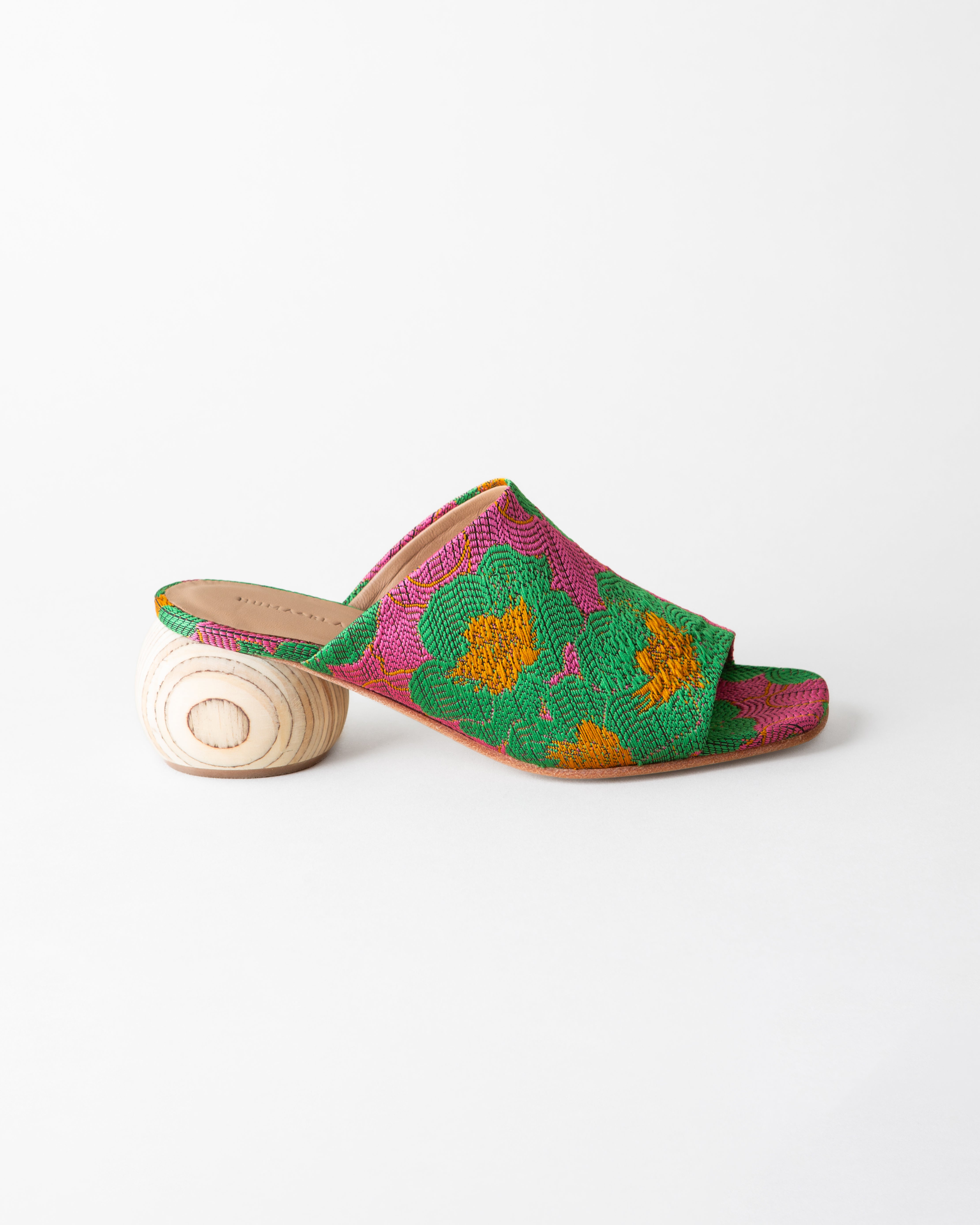 Colorful sandal with floral pattern on a white background