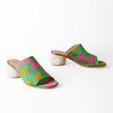 Colorful sandals with a floral pattern on a white background