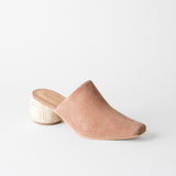 Brown suede slip-on shoe on a white background