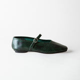A single dark green snakeskin Mary Jane flat shoe with a pointed toe and a small silver buckle, shown in profile against a light gray background.