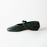 A single dark green snakeskin-patterned flat shoe with a Mary Jane strap, shown in profile against a plain white background.