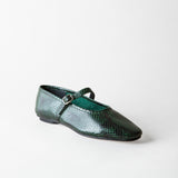 A single dark green snakeskin-textured Mary Jane flat shoe with a small silver buckle, shown on a light gray background.