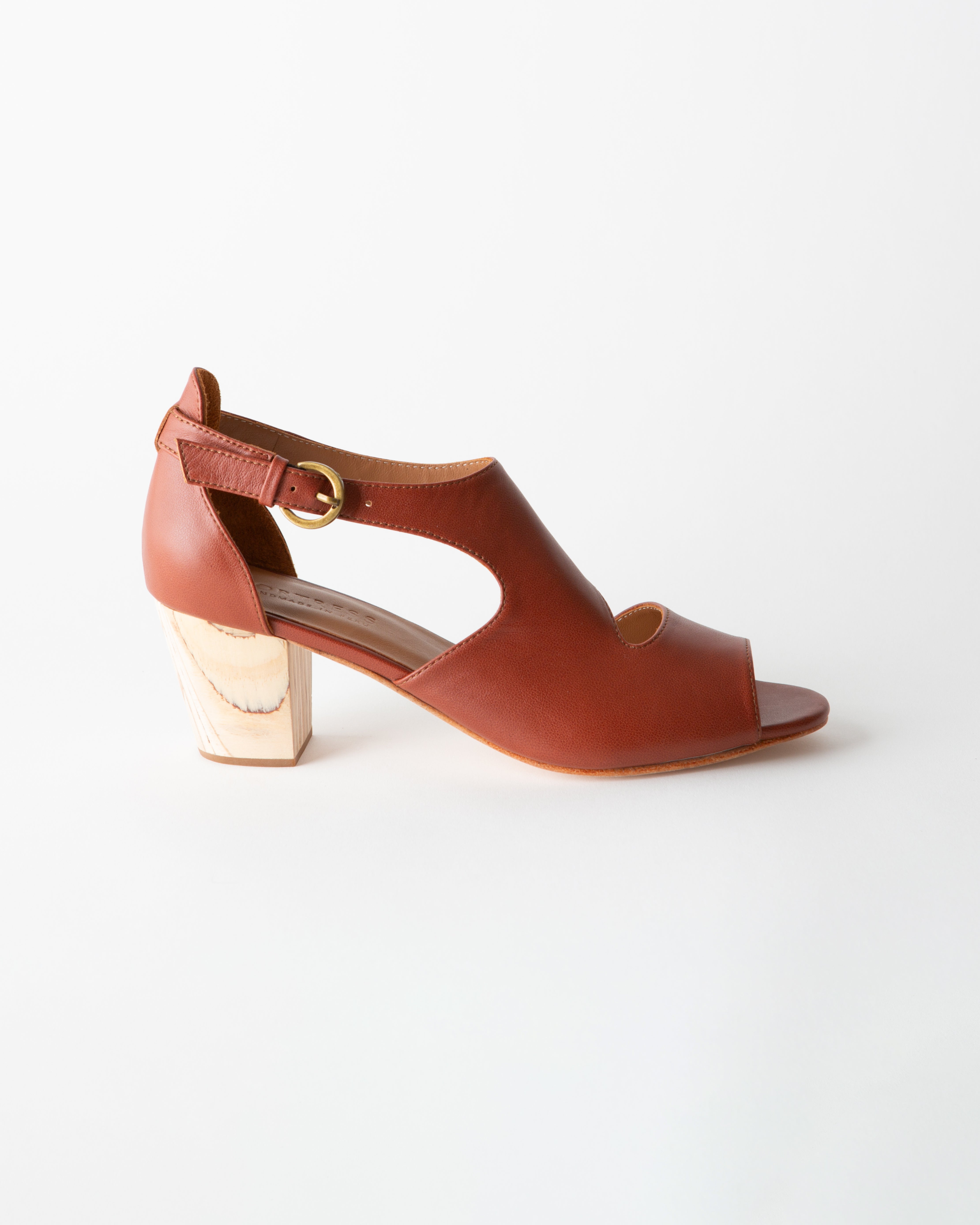 Brown sandal with a wooden block heel on a white background