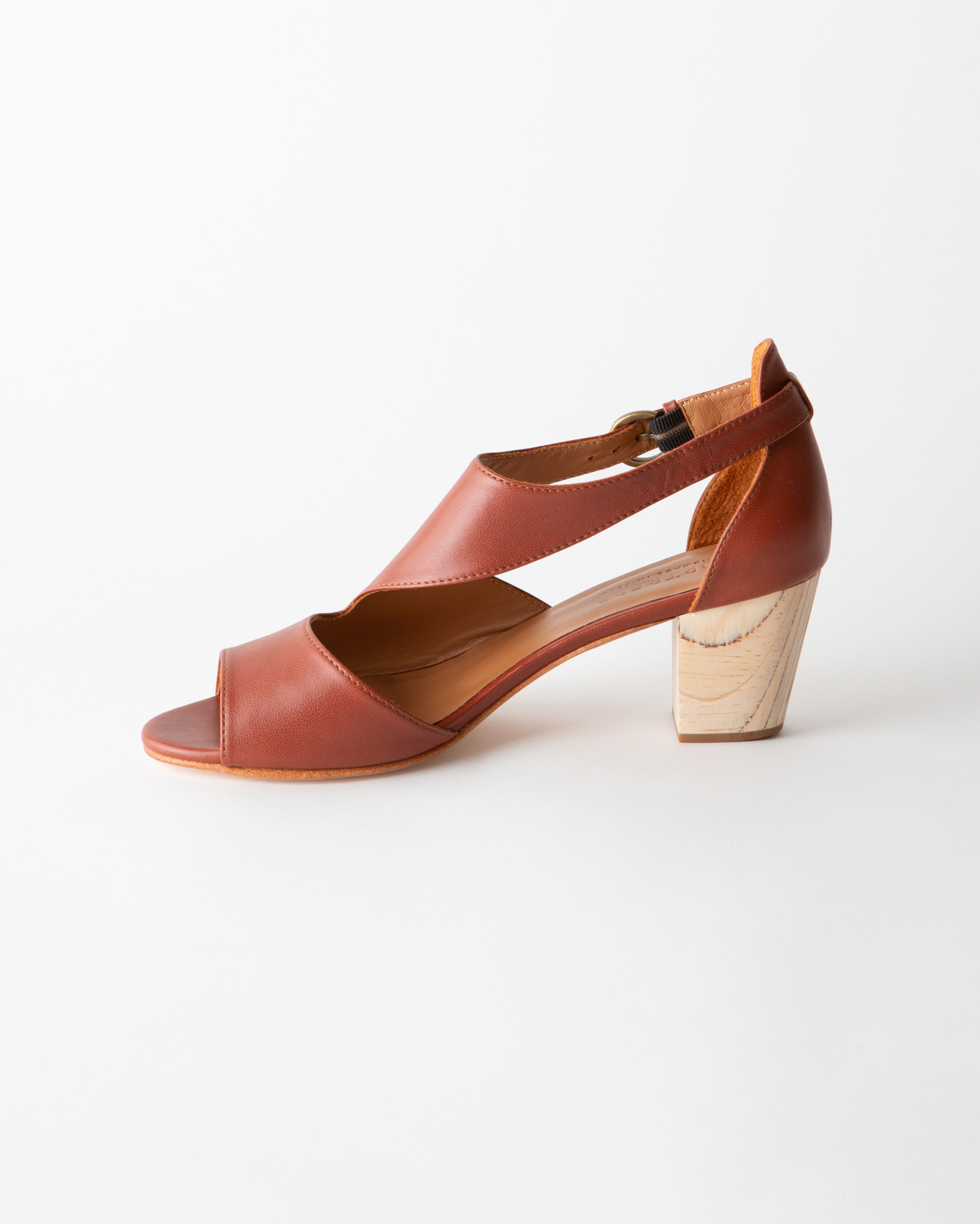Brown sandal with wooden heel on a white background